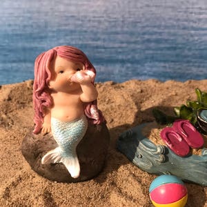Adorable mermaid blowing a seashell. mermaid playing with a shell to make music, beach miniatures, nautical miniatures, fairy garden beach
