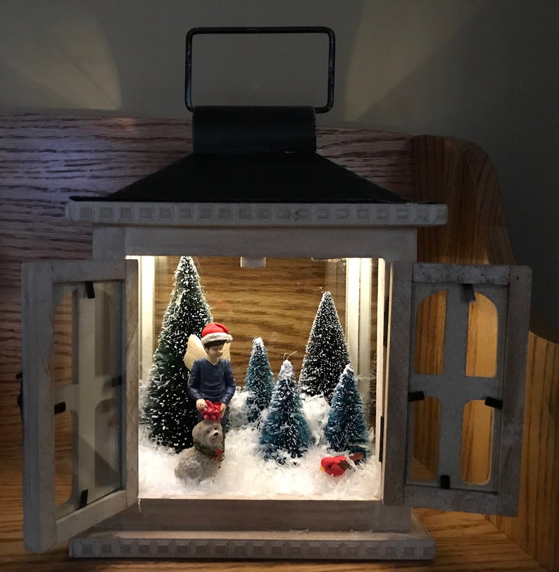 Sweet fairy boy with his dog out in the woods and winter snow scene in a french door lantern image 2