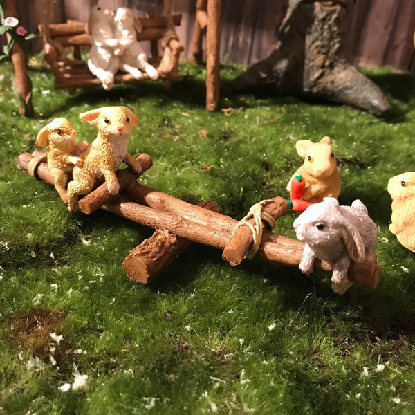 Sweet bunnies on teeter totter, playing bunnies on fairy playground, miniature bunnies, miniature rabbits playing, 3 miniature bunny rabbits