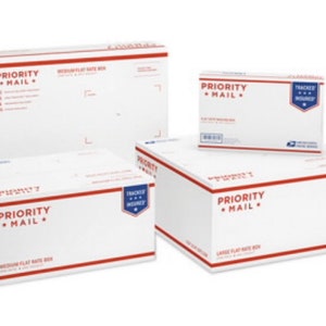 May include: Three white Priority Mail boxes with red and blue accents. The boxes are labeled "Priority Mail" and "Medium Flat Rate Box" and "Large Flat Rate Box".