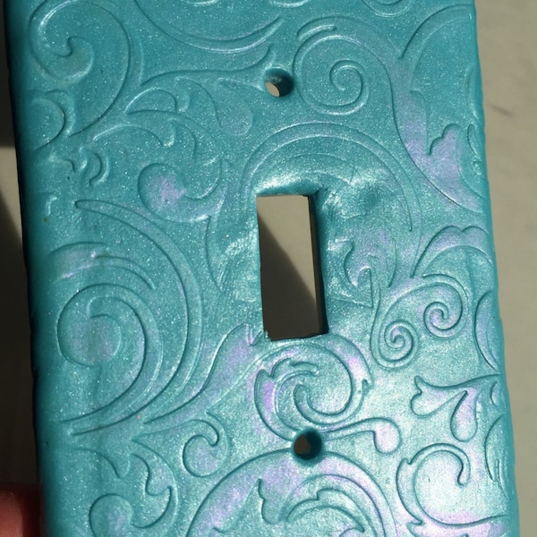 Beautiful light switch plate cover swirls of shimmering pastels on aqua single switch plate with new popular spring colors on standard size