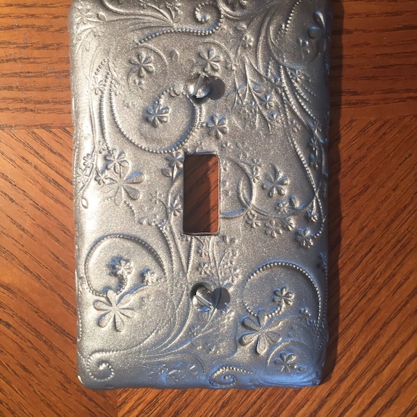 This elegant and beautiful switch plate has a flowery vine pattern in a silver shimmer color Single toggle light switchplate, large orders