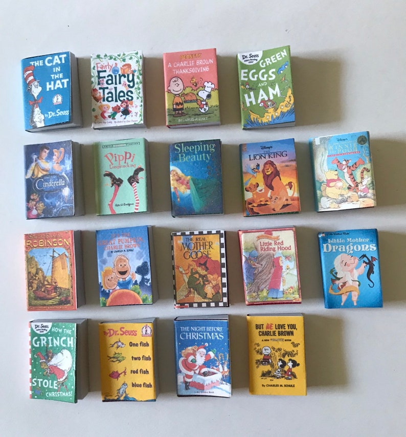 May include: A collection of 18 miniature children's books, including classics like "The Cat in the Hat", "Green Eggs and Ham", "Cinderella", "The Lion King", and "Little Red Riding Hood".