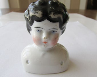 small porcelain doll heads