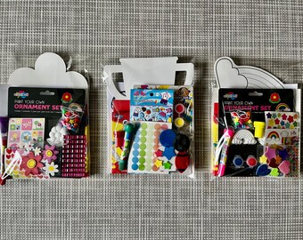 Craft packs. Three designs to choose from. Filled with painting set, textas, cardboard cut out, stickers, stamps, gem stickers plus more!