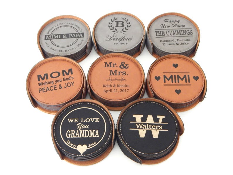 May include: Set of ten leather coasters with personalized engravings. The coasters are in various colors, including brown, black, and gray. The engravings include names, dates, and messages.