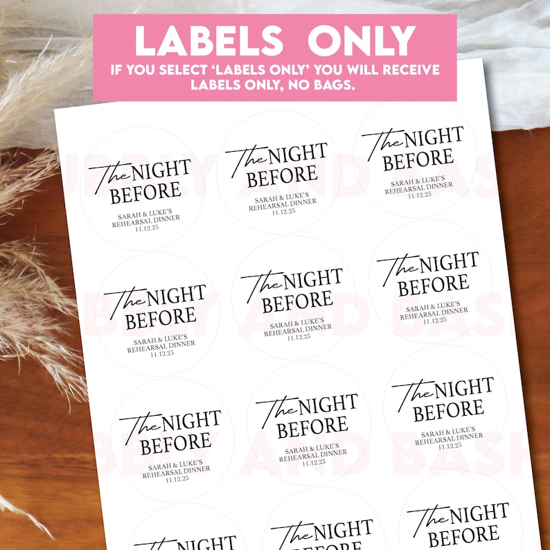 May include: A sheet of white, round labels with black text. Each label reads "The Night Before" with the names "Sarah & Luke" and the date "11.12.25". A pink banner at the top reads "LABELS ONLY".
