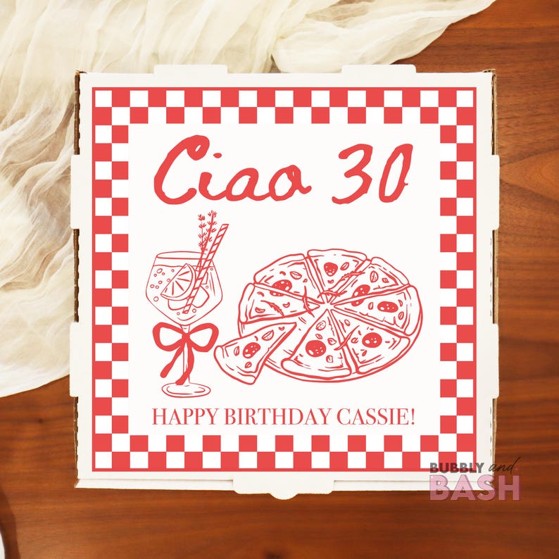 May include: A white pizza box with a red checkered border and red text that says "Ciao 30" and "Happy Birthday Cassie!". The box features a pizza graphic, a cocktail, and a bow.