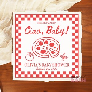May include: A white pizza box with a red checkered border and red text. The text reads "Miller Pizzeria" and "Ciao, Baby!". A pizza illustration is in the center, with the text "Olivia's Baby Shower August 26, 2026" below.