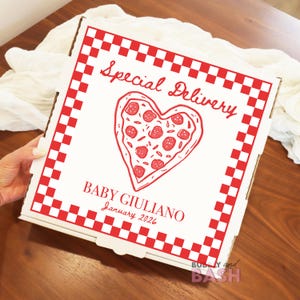 May include: A white pizza box with a red checkered border and the words "Special Delivery" in a script font. A heart-shaped pizza graphic is in the center. The text "BABY GIULIANO January 2026" is below the pizza graphic.