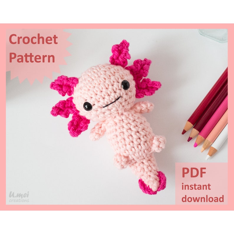 May include: A pink crocheted axolotl amigurumi toy with pink gills. The toy is lying on a white surface. The text "PDF instant download" is in the bottom right corner of the image.