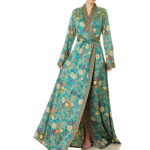 May include: A long teal blue robe with a floral pattern and gold accents. The robe has a black and gold trim and a sash tie at the waist.