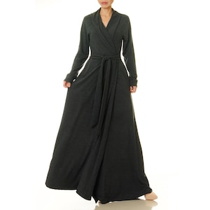 May include: A long-sleeved, charcoal grey wrap dress with a wide, self-tie sash. The dress has a V-neckline and a relaxed fit.