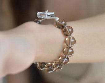 スモーキークォーツ10mm天然石ブレスレット • クリスタルトグルクラスプ