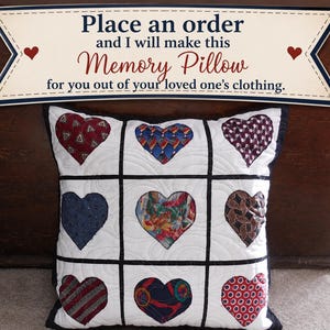 May include: A square white pillow featuring a grid of nine heart-shaped fabric patches in various colors and patterns. Above the pillow, a sign reads: Place an order and I will make this Memory Pillow for you out of your loved one's clothing.
