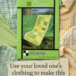 May include: A pattern booklet titled Clover by Tricia Lynn Maloney for Villa Rosa Designs, featuring a green patchwork table runner on a bench. Below, a fabric label reads: Use your loved one's clothing to make this table runner. The booklet is surrounded by various green and yellow plaid and solid fabric pieces.