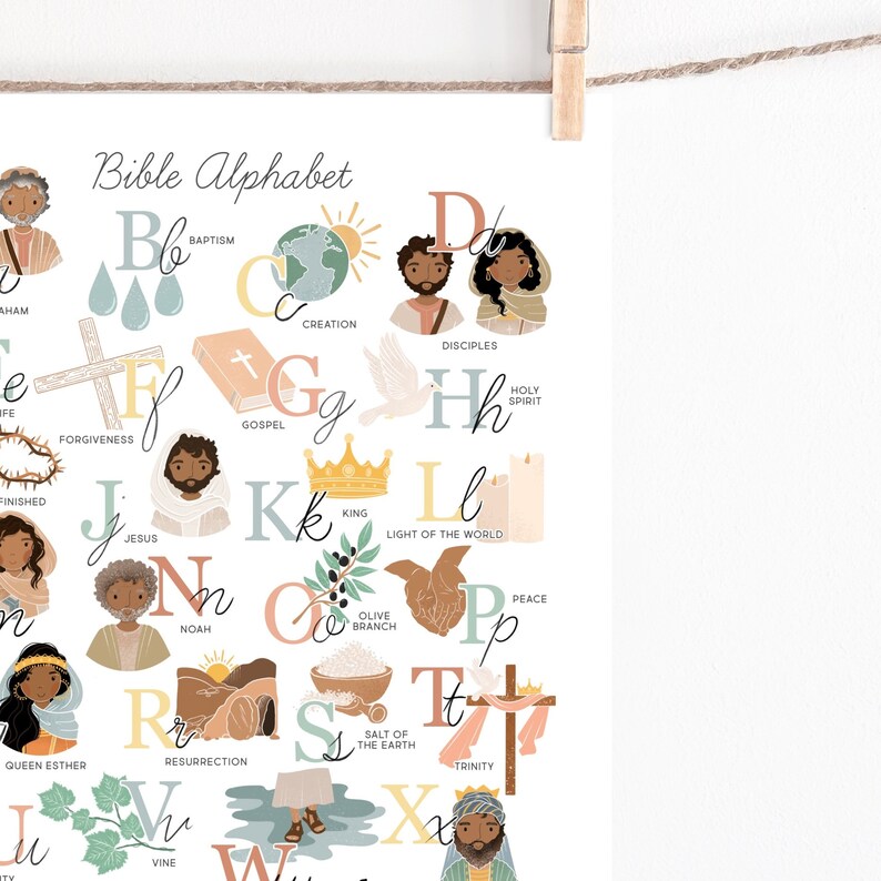 May include: A colorful Bible Alphabet print featuring illustrations for each letter. The artwork includes images of a cross, dove, crown, and other religious symbols. The text "Bible Alphabet" is at the top.