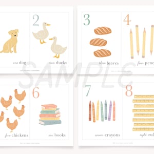 May include: A set of eight colorful flashcards with numbers 1 through 8, each featuring a different object and the corresponding quantity. The objects include a dog, ducks, loaves of bread, pencils, chickens, books, crayons, and rulers.