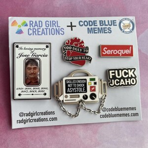May include: A collection of enamel pins with various designs. One pin features a photo and the text "In loving memory of Jose Garcia." Other pins include a red heart, the word "Seroquel," and a medical device with the text "Skilled enough not to shock asystole."
