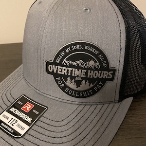 Overtime Hours leather patch Trucker hat