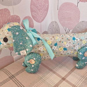 Dachshund toy dog, soft toy dog. handmade Dachshund plushie in vibrant floral fabric. Sausage dog cuddly toy with movable legs sits & stands