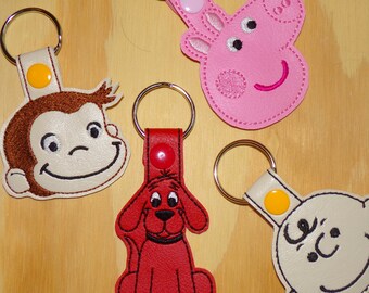 Free shipping!  Clifford, Curious, Peppa, Charlie assorted, beloved kids character vinyl key fobs!