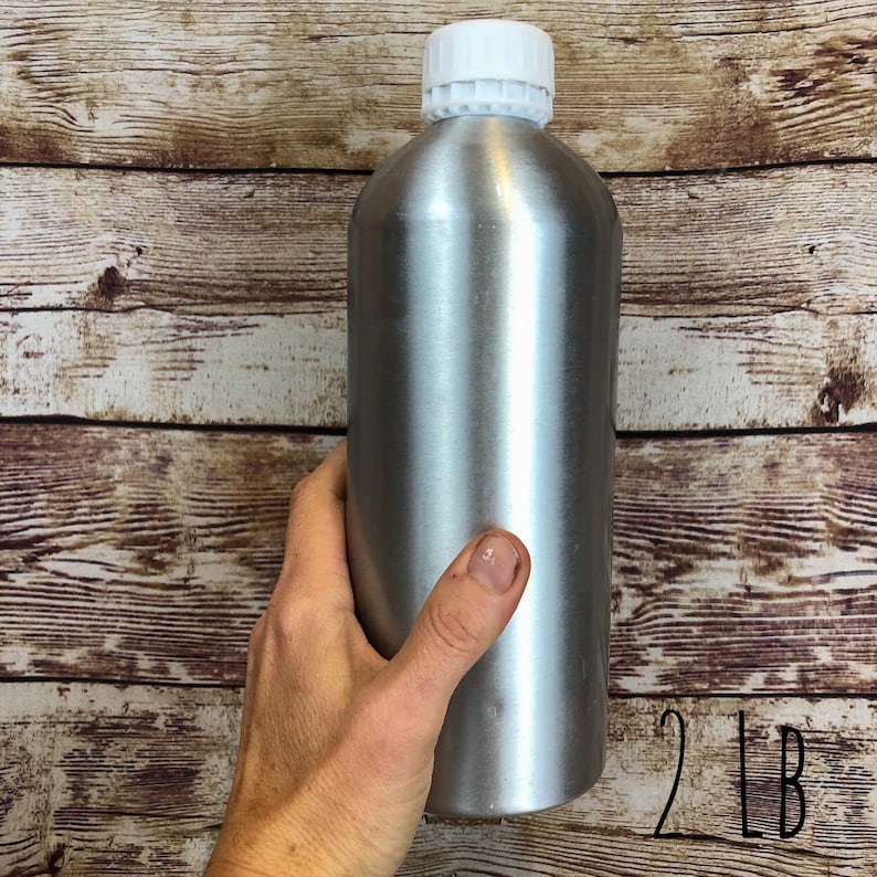 May include: A silver aluminum bottle with a white lid. The bottle is 2 pounds.