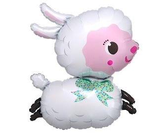 May include: A white and pink foil balloon shaped like a lamb with a green and white polka dot bow. The lamb has a pink face with black eyes and a black nose.