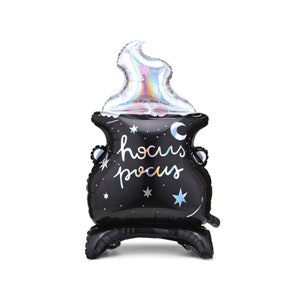 May include: Black cauldron shaped foil balloon with iridescent flame and "hocus pocus" text.