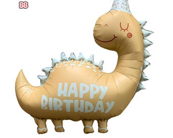 Pode incluir: Um balão de dinossauro marrom claro com um chapéu de festa branco e as palavras "Feliz aniversário" impressas nele.