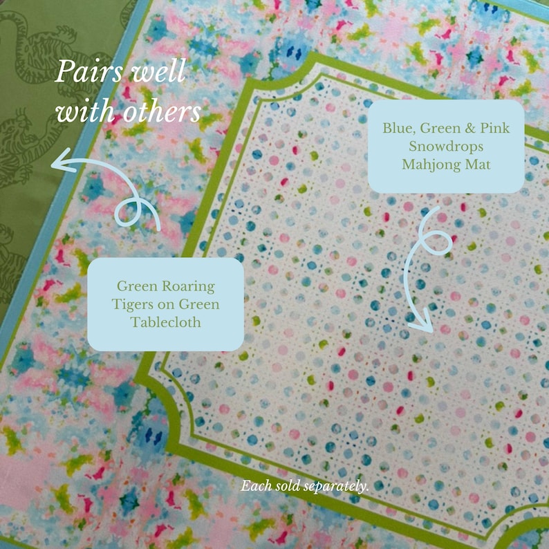 May include: A square mahjong mat featuring a white center with blue, green, and pink polka dots, bordered by a green frame and a floral pattern in blue, pink, and green. To the left, a green tablecloth displays a repeating tiger pattern.