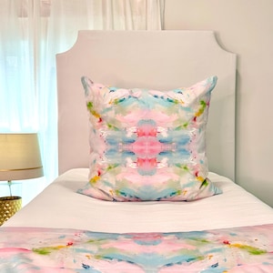 Pillow and duvet on twin bed.