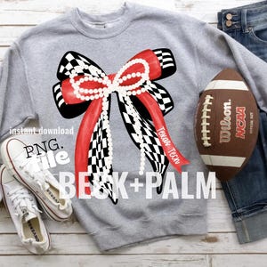 May include: A gray sweatshirt featuring a large bow design with red and black checkered patterns, a pearl necklace, and the text "Texas Tech." A football and white sneakers are also visible. The text "BECK+PALM" is displayed.