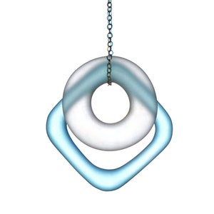 May include: A silver chain hangs from a light blue glass ring with a larger, frosted glass ring inside. The rings are suspended from a silver chain.