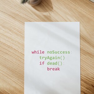 May include: A white sheet of paper with the code "while noSuccess: tryAgain() if dead(): break" written in green and pink.