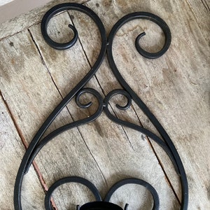 Black wrought iron wall sconce candle holder