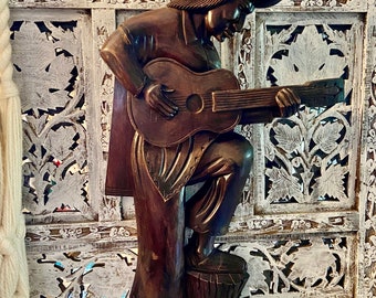 vintage wood wall hanging guitar player