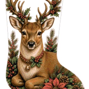 May include: A white Christmas stocking featuring a detailed illustration of a brown deer with large antlers. The deer is surrounded by green pine branches, red berries, pinecones, and a red poinsettia flower. The deer wears a collar with a gold bell.