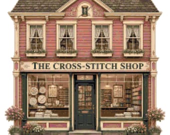 May include: A two-story building with pink siding and a dark roof, featuring a storefront with the text THE CROSS-STITCH SHOP. The facade includes four upper windows with white curtains, a central dark door, and large display windows.
