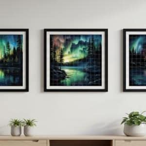 May include: Three framed landscape art prints depicting a colorful aurora borealis over a lake and forest. The artwork features vibrant hues of green, blue, purple, and yellow, with the forest silhouettes in black. The frames are black.