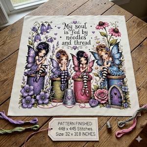 May include: A square fabric panel featuring four fairy illustrations sitting on colorful spools of thread, surrounded by flowers and a thimble. The text reads: My soul is fed by needles and thread. A tag indicates a finished size of 32 x 31.8 inches.