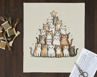 May include: A cross-stitch design depicting a Christmas tree formed by numerous cat illustrations. The cats are in shades of brown, white, and grey, with a gold star at the top. The design is on a beige fabric.