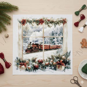 May include: A cross-stitch Christmas scene depicts a red train traveling through a snowy landscape, viewed through a window. The window is decorated with festive greenery, red bows, and ornaments. Crafting supplies, including thread, scissors, and a gingerbread man, surround the artwork.