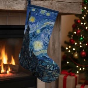 May include: A Christmas stocking featuring Van Gogh's "Starry Night" painting. The stocking is blue with a dark blue cuff and is hanging from a wooden mantel. A Christmas tree and fireplace are in the background.