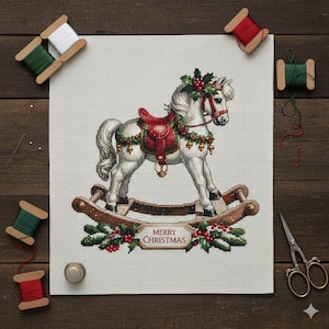 May include: A cross-stitch design of a white rocking horse decorated for Christmas. The horse has a red saddle, garland, and bells. The words "MERRY CHRISTMAS" are stitched below. Spools of thread and scissors surround the design.