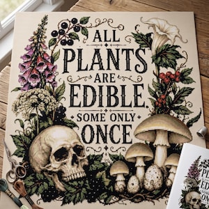 May include: A cross-stitch pattern on fabric featuring the black text ALL PLANTS ARE EDIBLE SOME ONLY ONCE surrounded by illustrations of purple foxgloves, black berries, a white skull, mushrooms, and a white flower with green leaves.