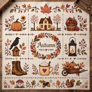 May include: A cross-stitch sampler on cream fabric featuring a grid of seasonal motifs including a pumpkin, a house, a basket of apples, a crow on a birdhouse, a lantern, boots, a mug with whipped cream, a wheelbarrow, and a squirrel.