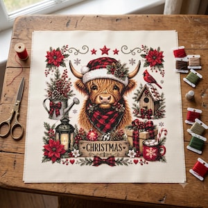 May include: A square cross-stitch fabric piece featuring a Highland cow wearing a Santa hat and red plaid scarf, surrounded by poinsettias, a birdhouse, a lantern, a gift, and a mug with the text CHRISTMAS on a wooden sign below.