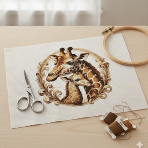 May include: A cross-stitch project featuring a giraffe and baby giraffe design, framed by a decorative border. The image includes scissors, embroidery floss, and a wooden embroidery hoop. The color palette includes shades of brown and beige.
