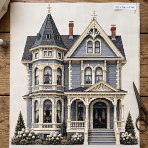 May include: A cross-stitch pattern on white fabric depicting a multi-storey blue house with a turret, a front porch, and stairs. The design includes two chimneys, detailed windows, and landscaping. A label in the corner reads (222 x 246 stitches).